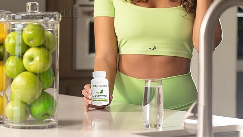 User holding MassZymes bottle from BiOptimizers